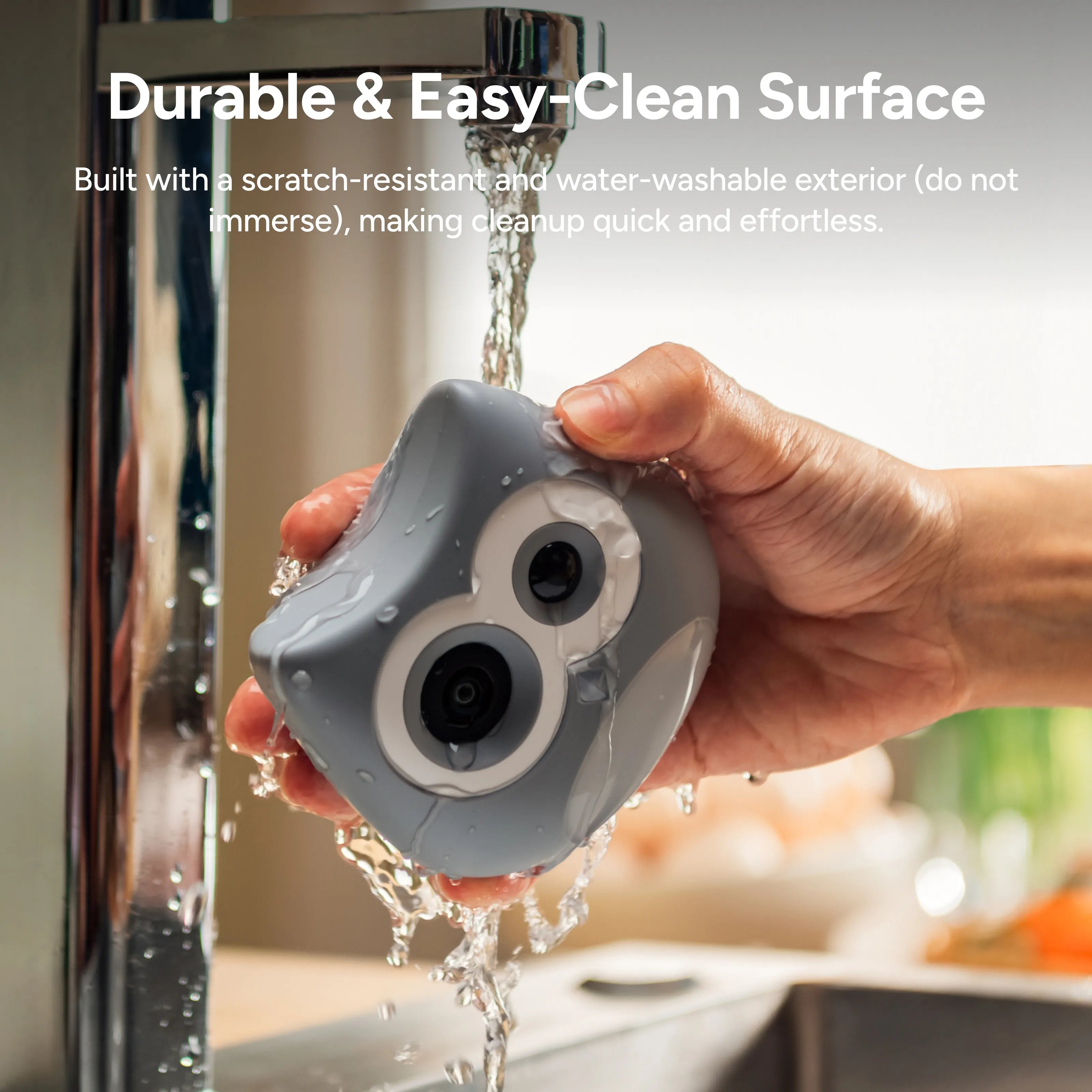 Hand holding a gray cleaning tool under running water with text about durability and ease of cleaning.