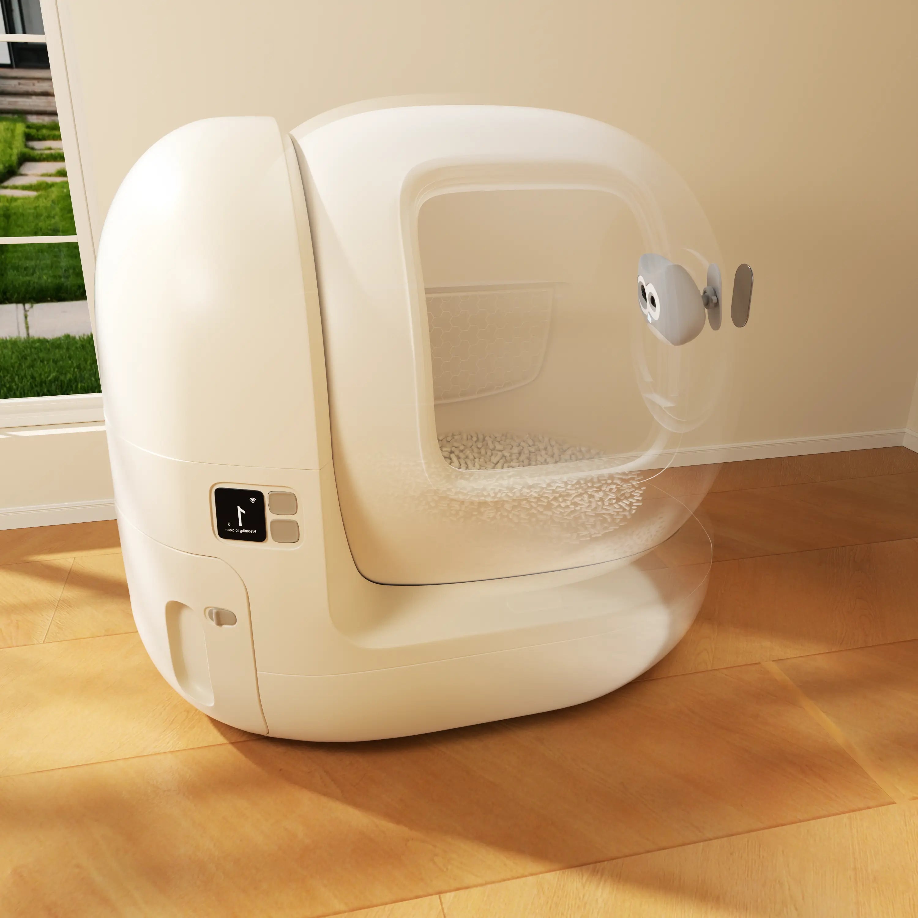 White self-cleaning pet litter box on a wooden floor with a grassy area outside.