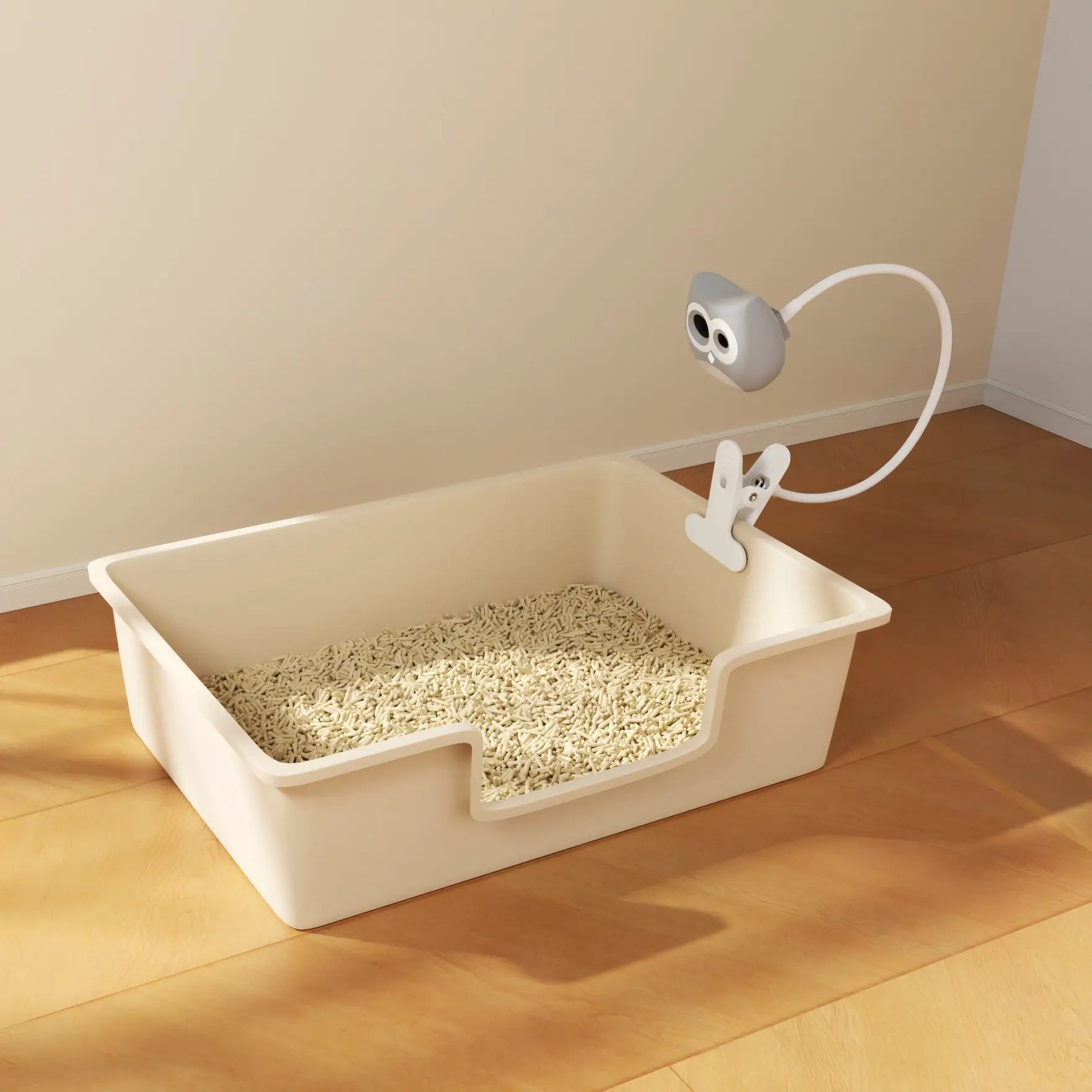 Cat litter box with a camera on a wooden floor
