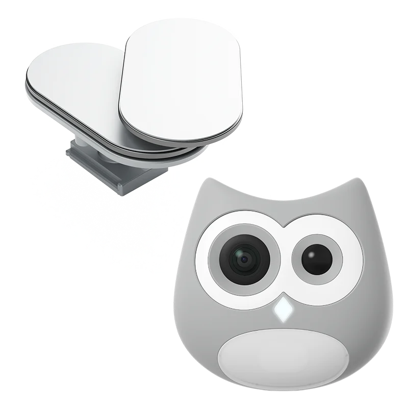 Pink owl-shaped camera with a white base on a white background