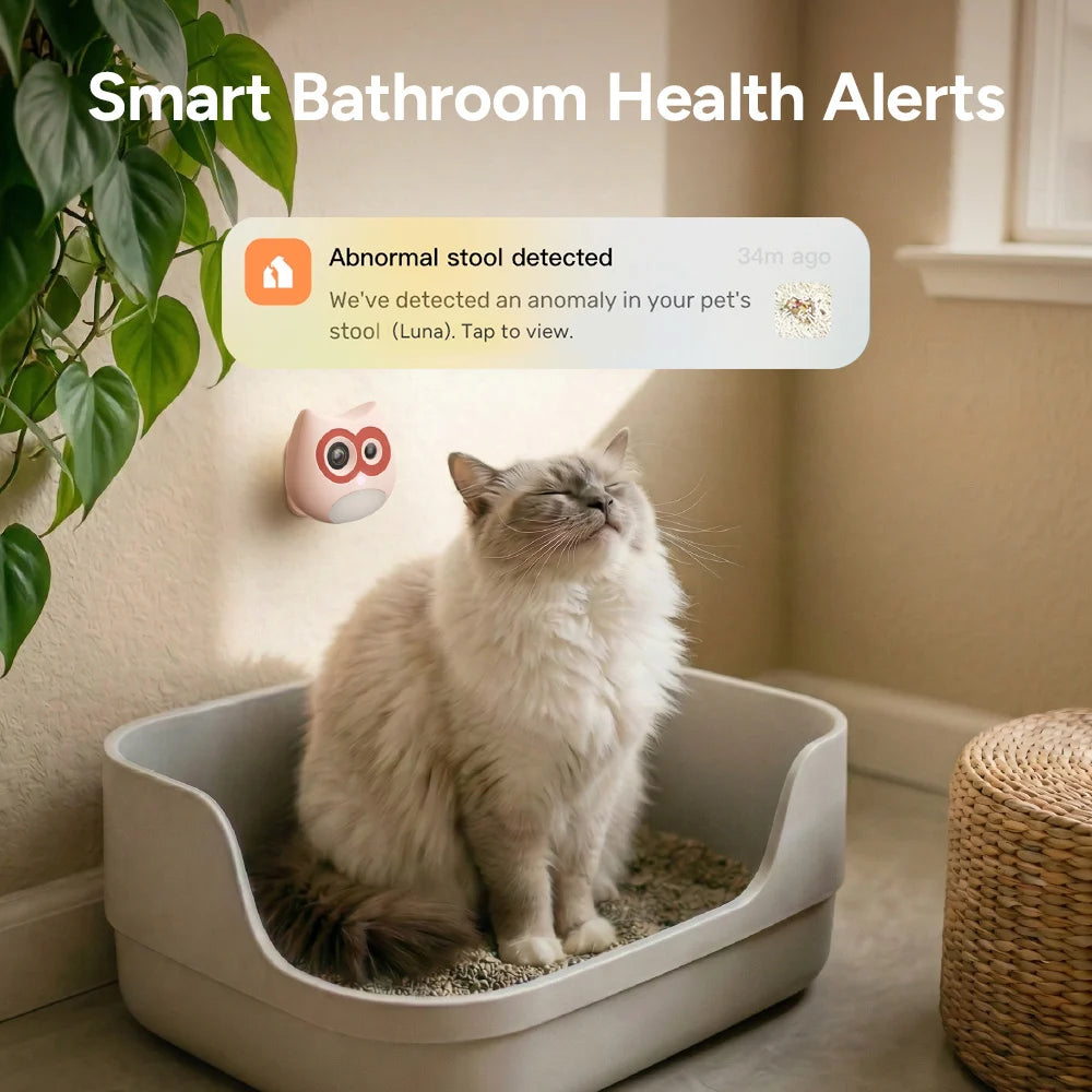 Cat using a smart litter box with health alert notification in a bathroom setting.
