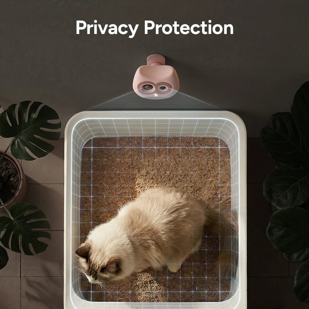 Cat using a litter box with a privacy protection device projecting a grid pattern on the wall.